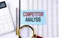 COMPETITOR ANALYSIS text on sticker on chart background, business concept Royalty Free Stock Photo