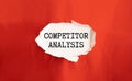 COMPETITOR ANALYSIS text on sticky on red notebook on chart background. Royalty Free Stock Photo