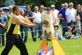 A competitor chops his log with an axe in the wood chopping event at a country show