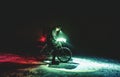 Competitor of winter night mtb race stop for possition control. Royalty Free Stock Photo