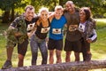 Competitors celebrate completing an extreme endurance event Royalty Free Stock Photo