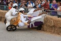 Competitors Crash Vehicle Into Hay Bales At Soap Box Derby