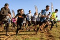 Competitors Sprint From Start Line At Obstacle Course Race