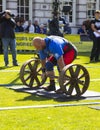 Competitors strain in the power lifting heat of the Ultimate Strongest Man competition.