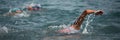 Competitors swimming out into open water