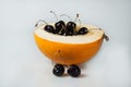 Compisition on white background with fruit. Melon, cherrys Royalty Free Stock Photo
