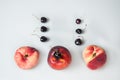 Compisition on white background with fruit. Peaches