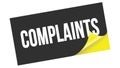 COMPLAINTS text on black yellow sticker stamp