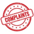 COMPLAINTS text on red grungy round rubber stamp