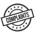 COMPLAINTS text written on black vintage round stamp