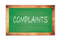 COMPLAINTS text written on green school board