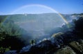 Complete arch rainbow over Iguazu Waterfalls in Parque Nacional Iguazu, border of Brazil and Argentina Royalty Free Stock Photo