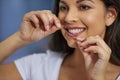 For complete clean and fresh breath, you must floss too. an attractive young woman getting ready in her bathroom. Royalty Free Stock Photo