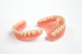 Complete denture on white background.