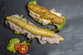 Complete healthy deli sandwich kornspitz whole grain and european pretzel sticks salzstangerl filled with meat slices and salad Royalty Free Stock Photo