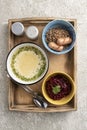 Complete healthy lunch with first and second course, salad and berry drink, top view.