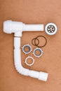 Complete kit for assembling a sink drain with flexible tube and accessories. Royalty Free Stock Photo