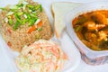 Complete lunch of rice, salad, bread and vegetable soup