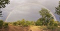 Complete rainbow in the bush after a rain storm Royalty Free Stock Photo