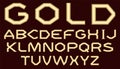 A complete set of Latin letters made of gold with a matte surface. A wide, angular, coarse font is insulated with a dark crimson b