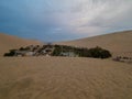 Complete view of Huacachina oasis in Ica desert Peru