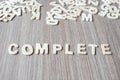COMPLETE word of wooden alphabet letters. Business and Idea