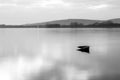 An almost completely sinked little boat in Trasimeno lake Umbria, Italy Royalty Free Stock Photo