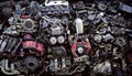 Complex arrangement of assorted car engine parts on a workbench in a garage Royalty Free Stock Photo