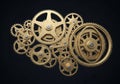 A complex arrangement of interlocking brass gears against a black background. The gears are of Royalty Free Stock Photo