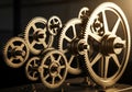 A complex arrangement of metallic gears with various sizes and radii, interlocked and aligned. The Royalty Free Stock Photo