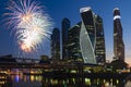 A complex of buildings of Moscow city on the background of fireworks. night scene