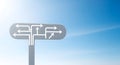 Complex direction sign with multiple diverging arrows against a clear blue sky, illustrating choice and decision-making pathways. Royalty Free Stock Photo