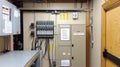 Electrical panel, circuit breakers, and wiring in building control room Royalty Free Stock Photo