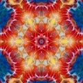 complex flower fantasy in shades of orange red blue and gold hexagonal design