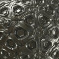 Complex geometric pattern with a metallic, reflective surface. Features interlocking Royalty Free Stock Photo