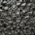 A complex network of connected bubble structures resembling a three-dimensional Royalty Free Stock Photo
