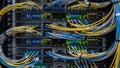 Complex network of server racks with colorful cables and blinking lights Royalty Free Stock Photo