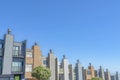 Complex townhouses in a slope with chimney flues against the clear sky in San Francisco, California Royalty Free Stock Photo