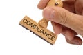 Compliance printed on rubber stamp Royalty Free Stock Photo