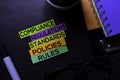 Compliance, Regulations, Strandards, Policies, Rules text on sticky notes isolated on Black desk. Mechanism Strategy Concept