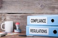 Compliance and Regulations. Two binders on desk in the office. Royalty Free Stock Photo