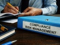 Compliance risk management papers in the folder. Royalty Free Stock Photo