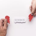Husband and wife planning divorce and holding broken heart
