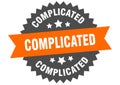 complicated sign. complicated round isolated ribbon label. Royalty Free Stock Photo