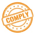 COMPLY text on orange grungy vintage round stamp