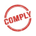 COMPLY text written on red grungy round stamp