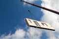 Component for a prefabricated house is transported from an orange jib of a mobile crane at a great height for assembly