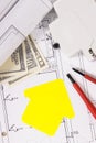 Components for electric installations, shape of house, construction diagrams, work tools and dollar banknotes. Building or buying Royalty Free Stock Photo