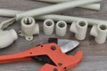Components making water pipes and special scissors for cutting pipes.