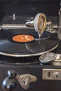 Components of an old gramophone from the company Odeon from Germany in the 1920s with a shellac disc, pickup, a box for the plate Royalty Free Stock Photo